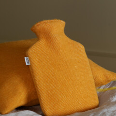 Lapuan Kankurit ARVO cushion cover and hot water bottle coffee dyed orange